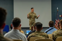 People speak on podium