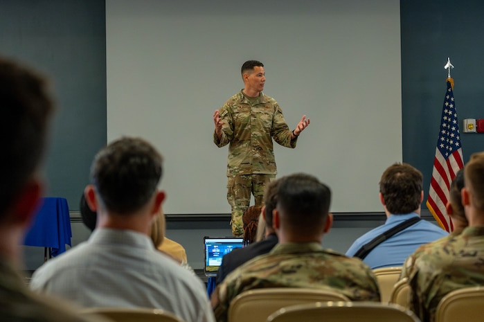 People speak on podium