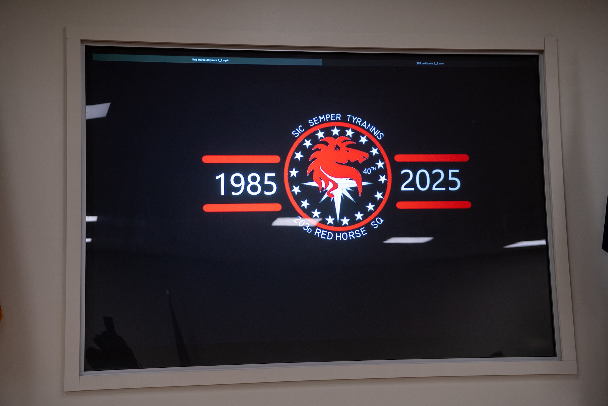 Digital display of 203rd RED HORSE symbol and 1985 to 2025.