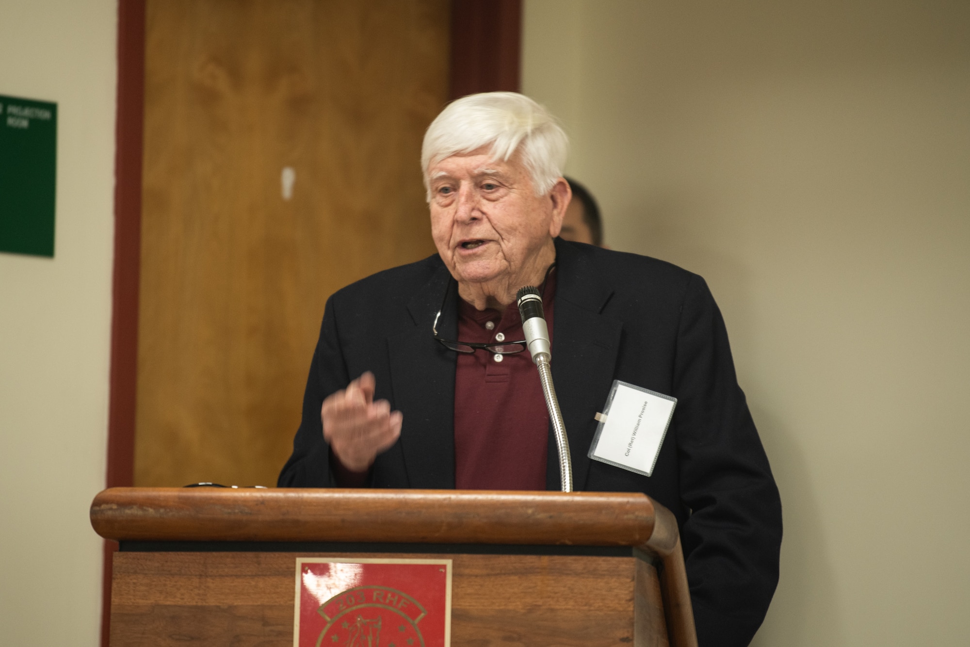 Man standing at podium.