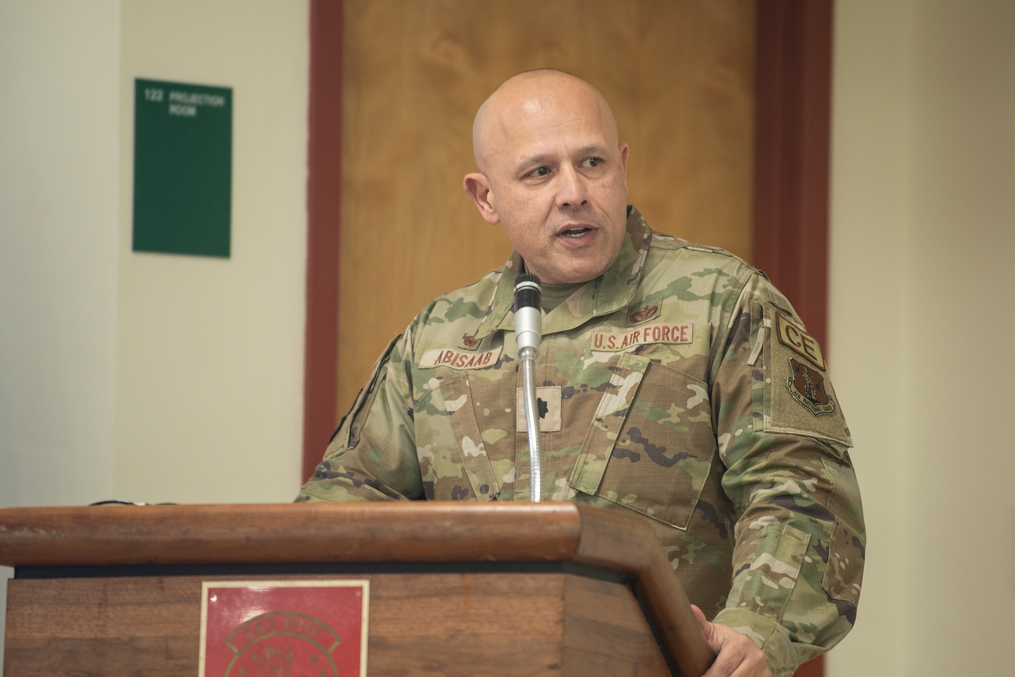 Lt. Col. Eddie Abisaab stands at podium.