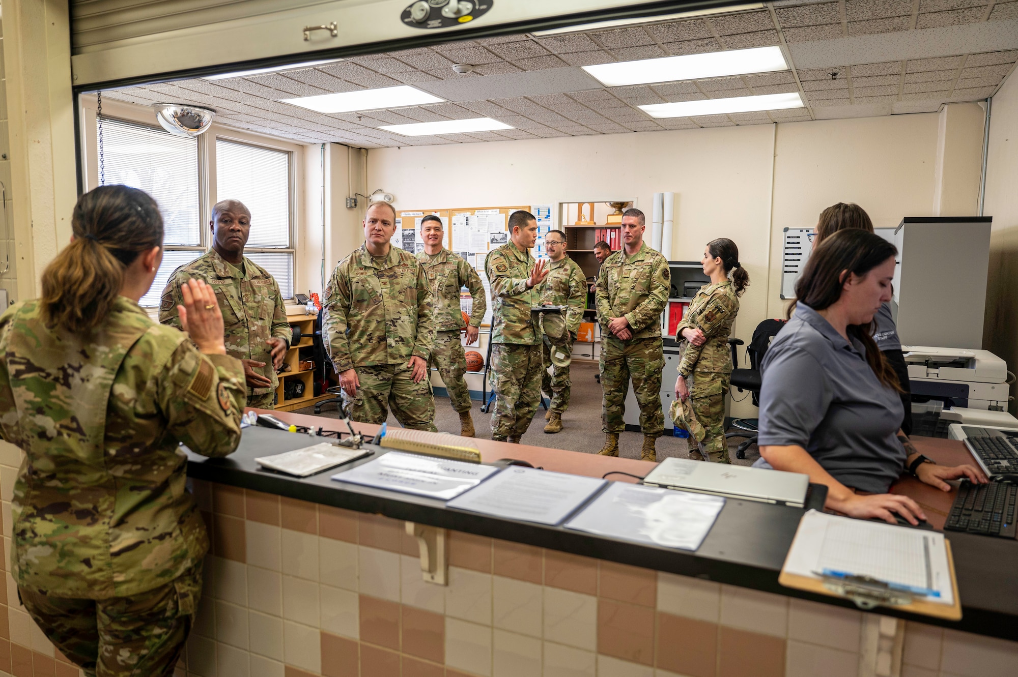 Members of Team Kirtland register at the East Side Fitness Center during a tour at Kirtland Air Force Base, N.M., Feb. 3. The Fitness Center offers facilities and equipment for Airmen to maintain physical readiness. (U.S. Air Force photo by Senior Airman Spencer Kanar)