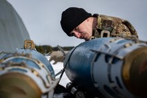 Airman performs an initial munition inspections