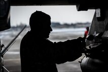 Airman loads ammunition onto a F-16