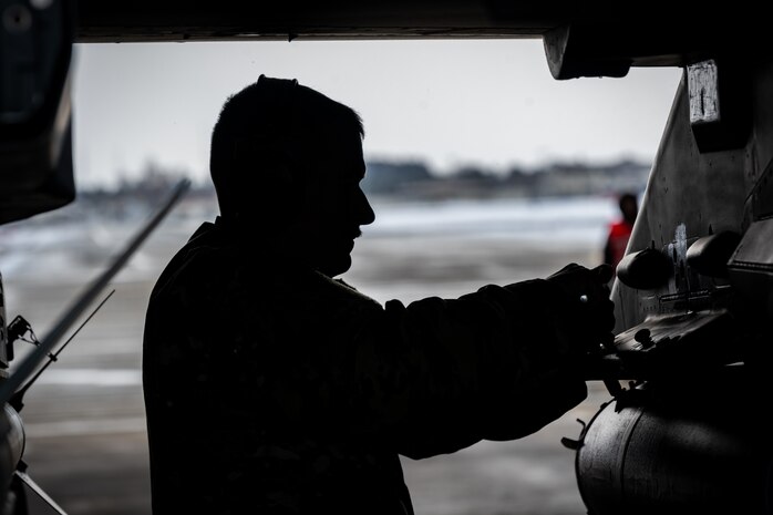Airman loads ammunition onto a F-16
