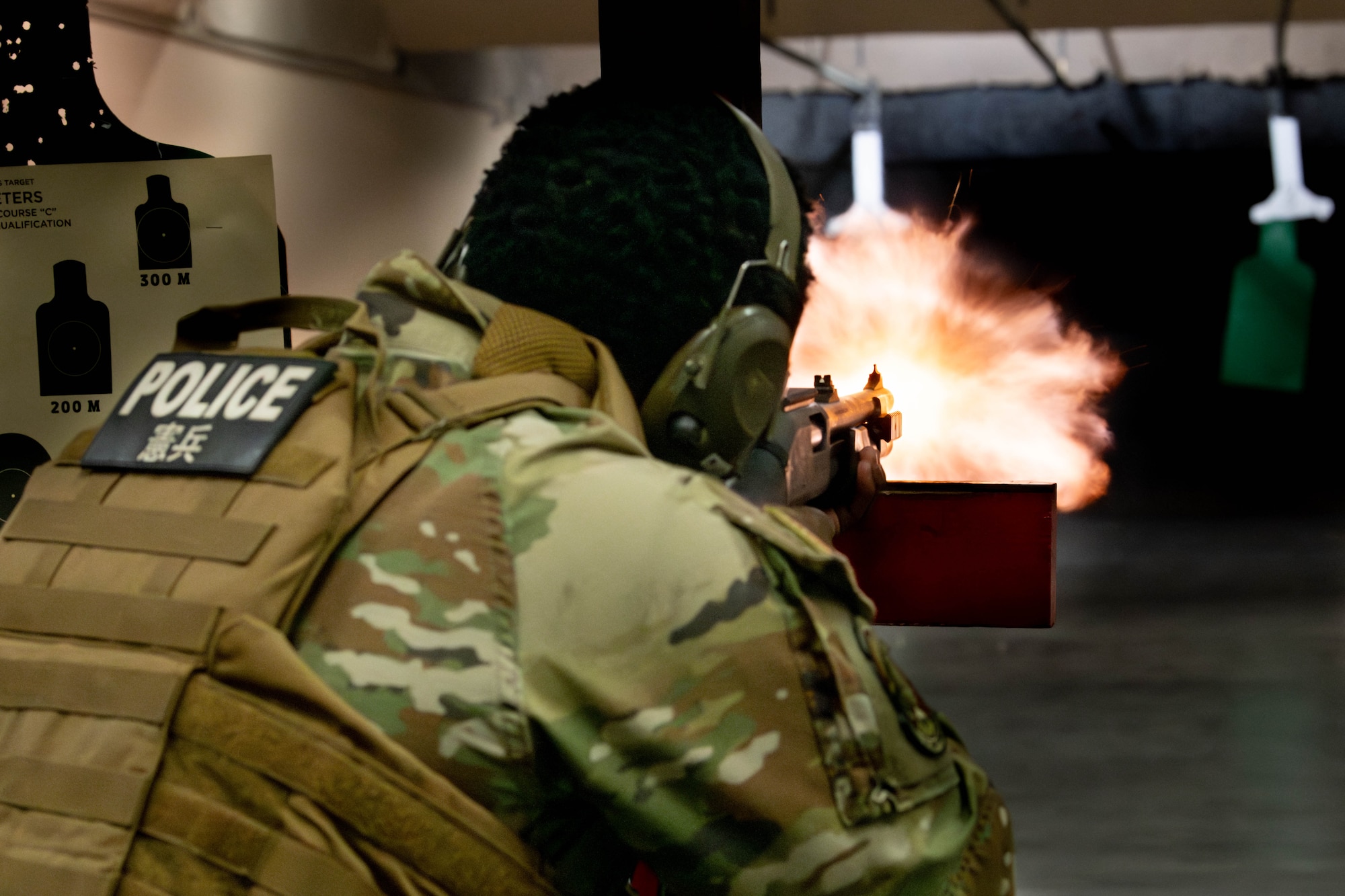 U.S. Air Force Senior Airman Jerell Moore, 374th Security Forces Squadron patrolman, fires a M870 shotgun.