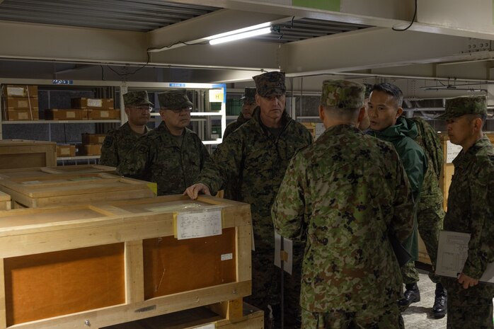 U.S. Marine Corps Brig. Gen. Kevin Collins, commanding general of 3rd Marine Logistics Group, center, and members of his command staff tour an ammunition supply warehouse with members of the Western Army Logistics Support Unit at the Kyushu District Depot on Camp Metabaru, Japan, Jan. 27, 2025.