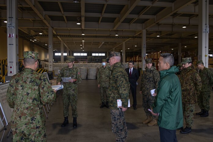 U.S. Marine Corps Brig. Gen. Kevin Collins, commanding general of 3rd Marine Logistics Group, and members of his command staff receive a brief from members of the Western Army Logistics Support Unit at a maintenance warehouse at the Kyushu District Depot on Camp Metabaru, Japan, Jan. 27, 2025.