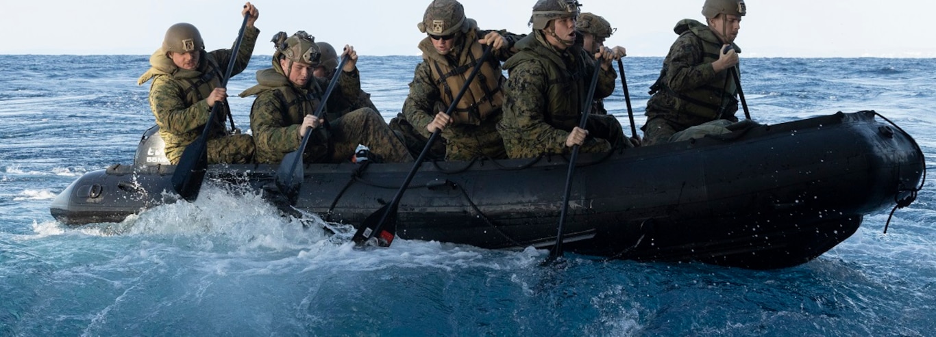 U.S. Marines with Battalion Landing Team 2/4, 31st Marine Expeditionary Unit, paddle away from the stern gate in an enhanced combat rubber reconnaissance craft (E-CRRC) during a launch and recovery sustainment training aboard amphibious transport dock USS San Diego (LPD 22), in the Philippine Sea on Jan. 29, 2025.