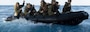 U.S. Marines with Battalion Landing Team 2/4, 31st Marine Expeditionary Unit, paddle away from the stern gate in an enhanced combat rubber reconnaissance craft (E-CRRC) during a launch and recovery sustainment training aboard amphibious transport dock USS San Diego (LPD 22), in the Philippine Sea on Jan. 29, 2025.