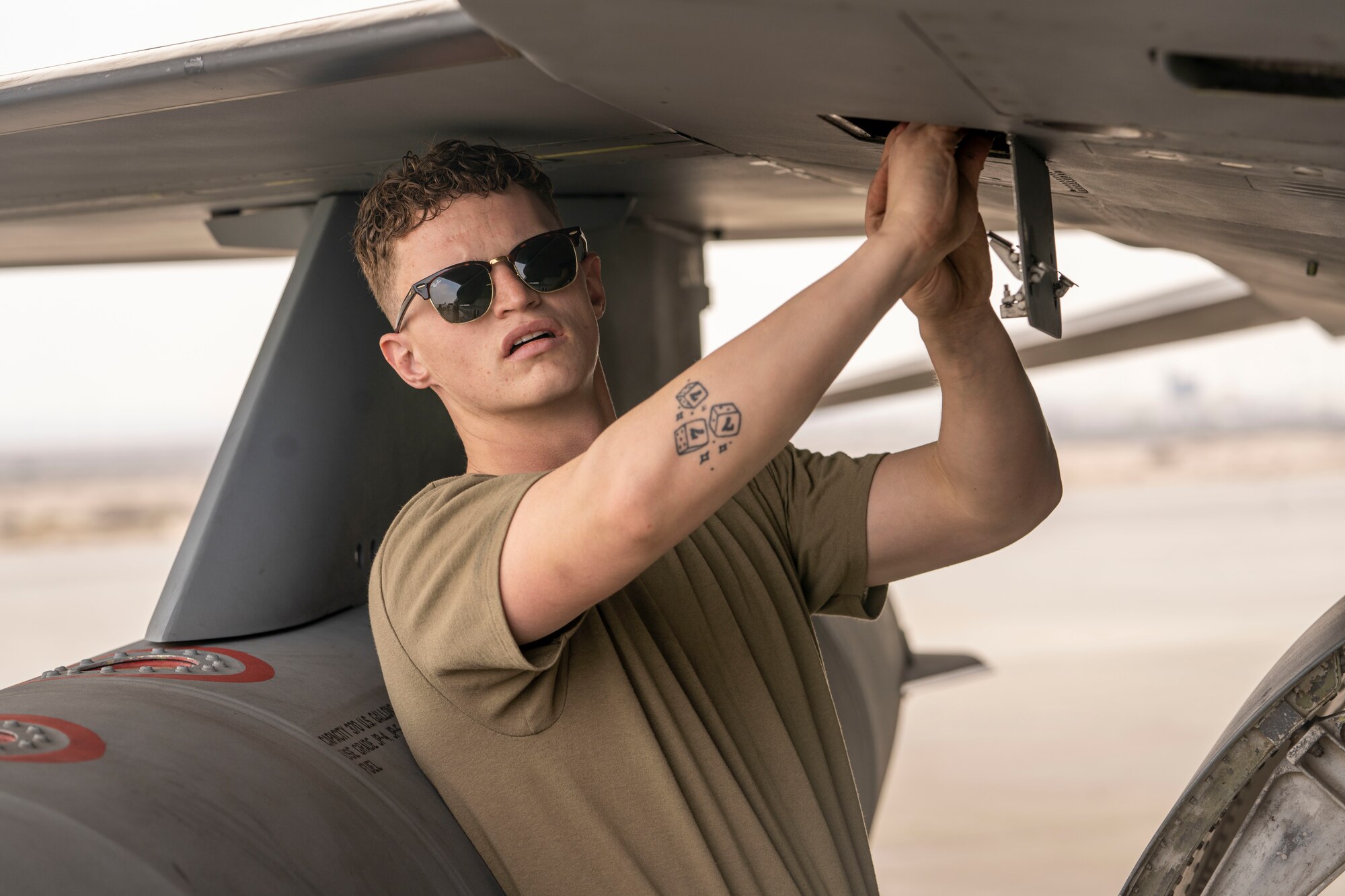 U.S. Air Force Airman 1st Class Garrett Holloway, 378th Expeditionary Maintenance Squadron assistant dedicated crew chief, recovers an F-16 Fighting Falcon during Exercise Spears of Victory, at King Abdulaziz Air Base, Saudi Arabia, Jan. 27, 2025.