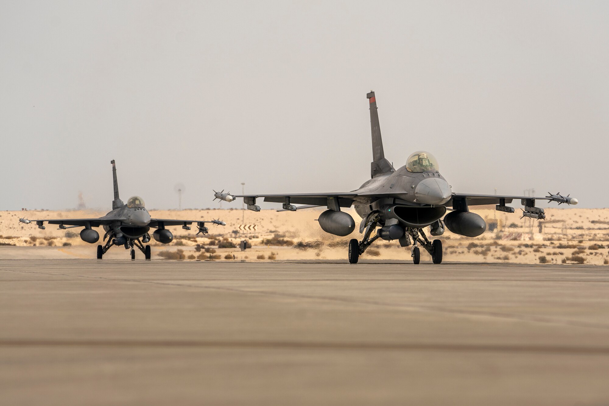 Two U.S. Air Force F-16 Fighting Falcons return from a training sortie during Exercise Spears of Victory, at King Abdulaziz Air Base, Saudi Arabia, Jan. 27, 2025.