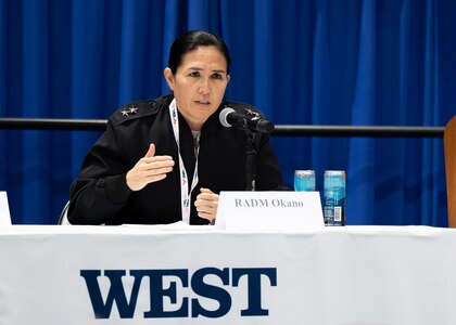 Rear Adm. Seiko Okano, commander, Naval Information Warfare Systems Command (NAVWAR), speaks with representatives from different booths at the Navy Information Warfare Pavilion during WEST Conference 2025.