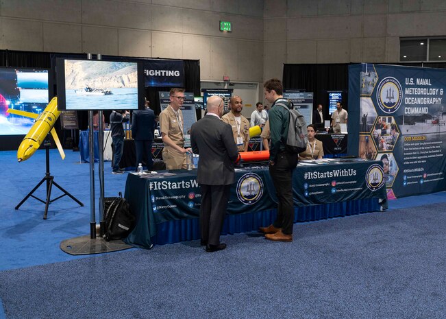Naval Meteorology and Oceanography Command representatives explain their mission and capabilities to industry partners during WEST Conference 2025.