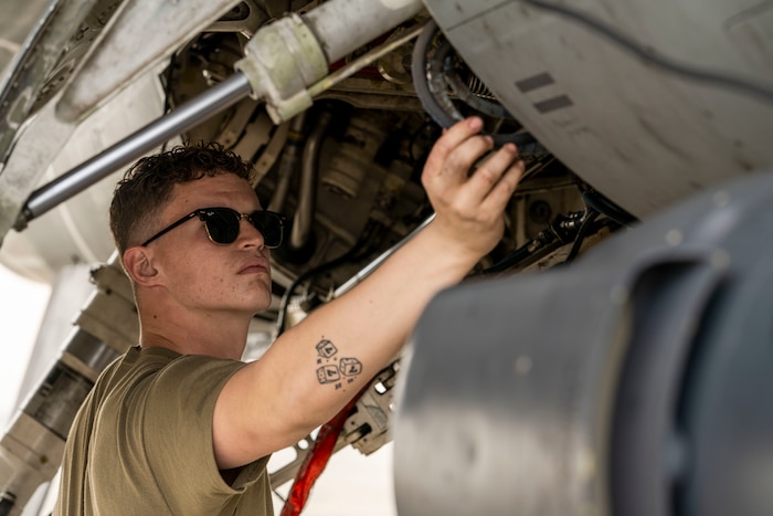 U.S. Air Force Airman 1st Class Garrett Holloway 378th Expeditionary Maintenance Squadron assistant dedicated crew chief, checks for leaks inside an F-16 Fighting Falcon as part of the aircraft recovery process during Exercise Spears of Victory, at King Abdulaziz Air Base, Saudi Arabia, Jan. 27, 2025.