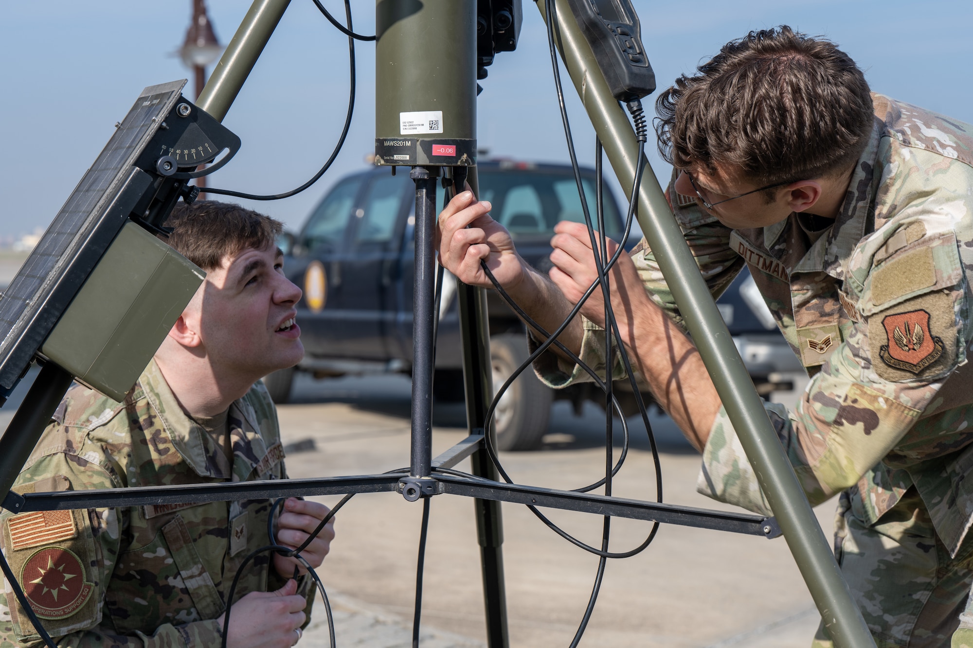 U.S. Air Force Senior Airman Jared Windsor, 39th Operations Support Squadron weather forecaster (left), and Senior Airman James Dittmann, 39th OSS radar airfield and weather systems technician, set up a Tactical Meteorological Observing System (TMQ-53) at Incirlik Air Base, Türkiye, Feb. 3, 2025. The portable weather system is designed for deployment in a wide range of terrains and environments, collecting weather data to enhance mission success. (U.S. Air Force photo by Senior Airman Vaughn Weber)