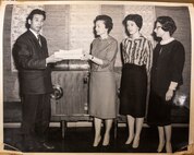 A volunteer of the Officer Wife Club is presented a certificate of appreciation at the Biko-en Orphanage in Shichinohe, Japan, Dec. 1967.