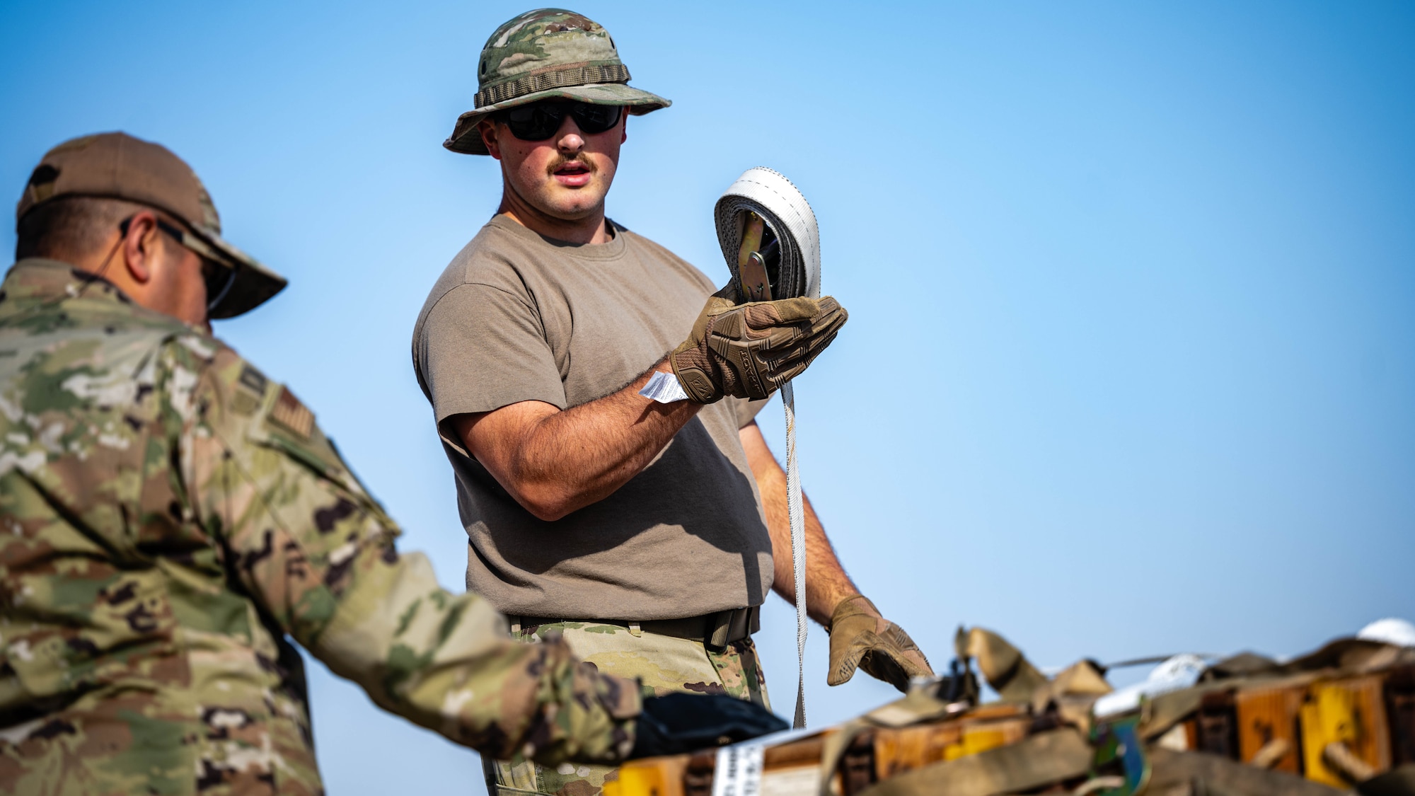 Airman secures a pallet.