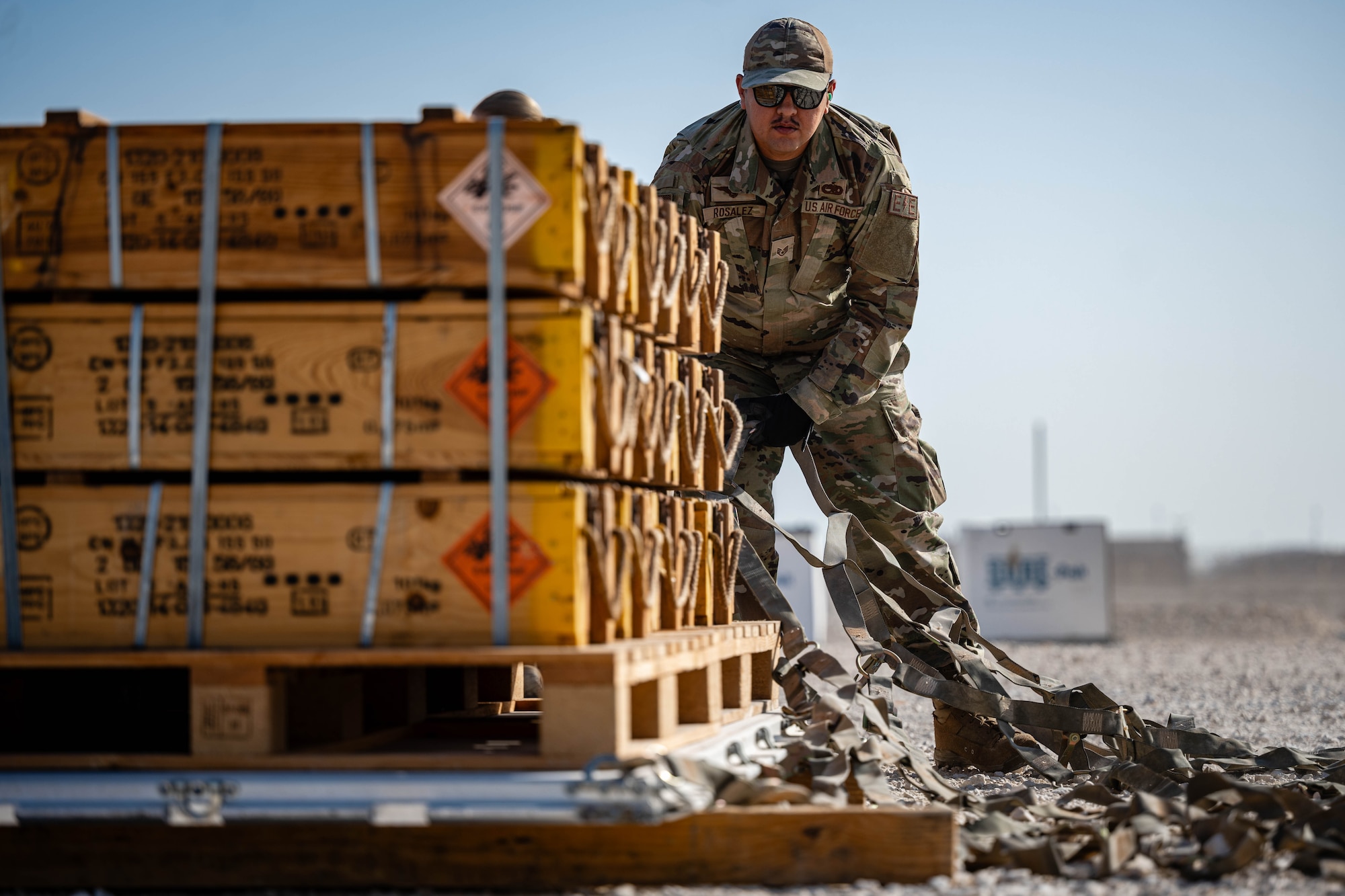Airman secures pallet.