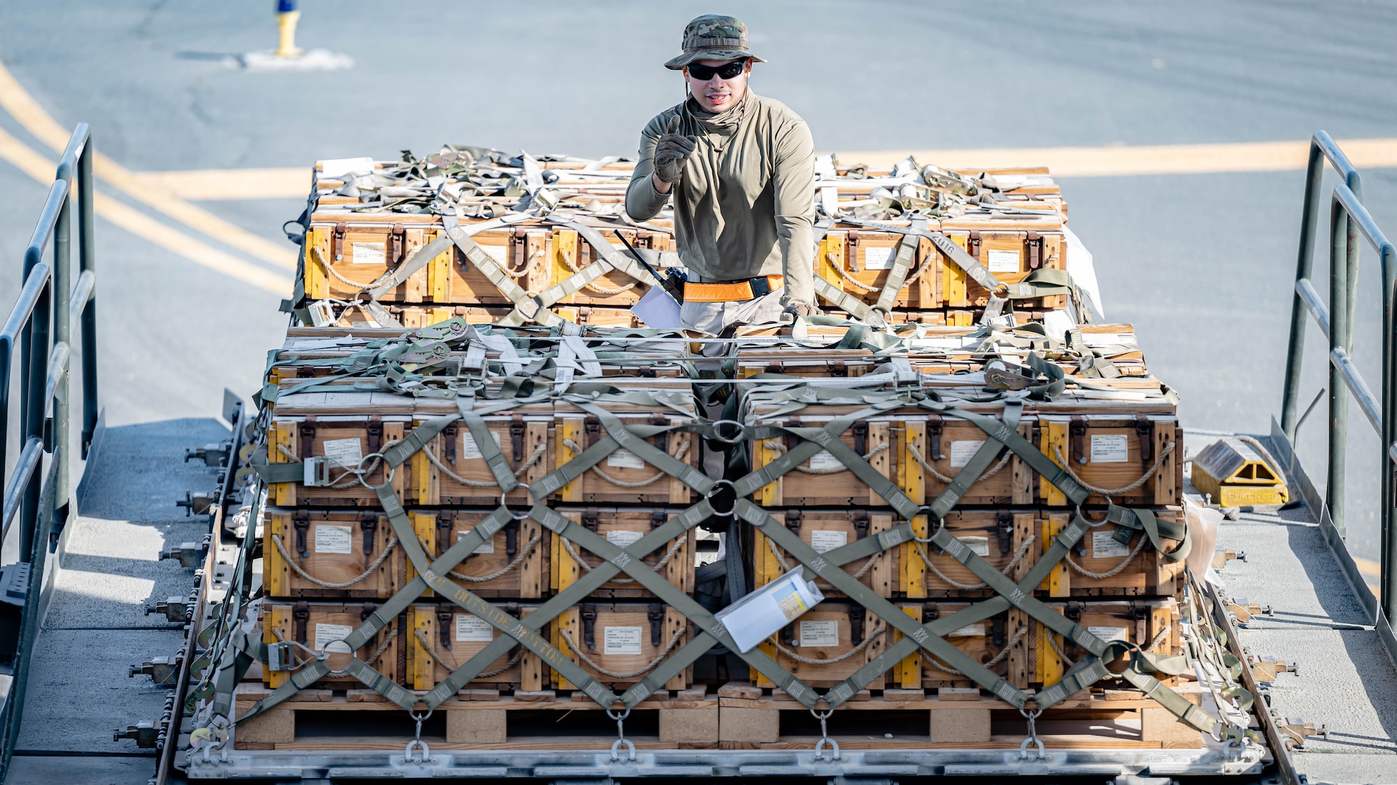 Airman loads pallets.