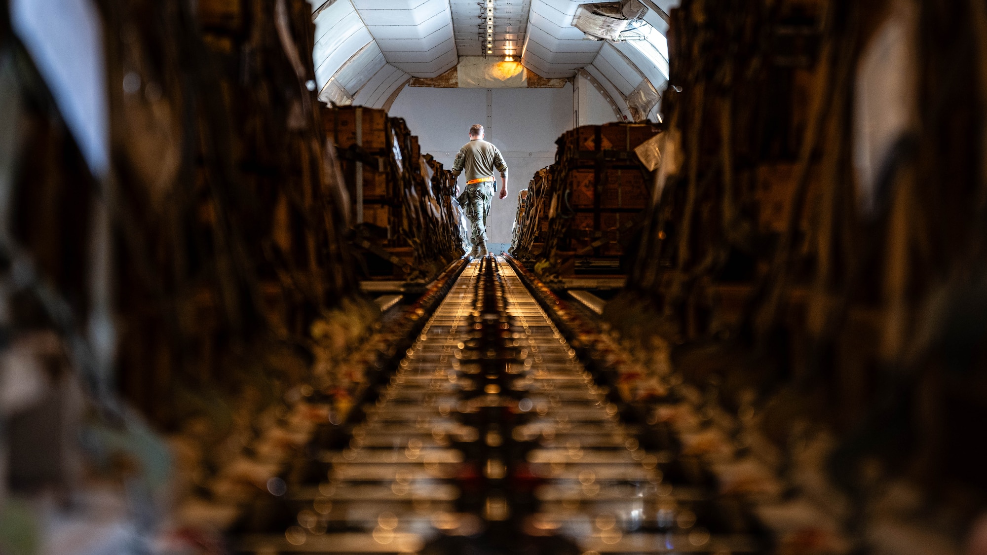 Airmen load pallets.