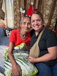 U.S. Master Sgt. Misty Palomo, right, assigned to the 254th Security Forces Squadron, Guam Air National Guard, visits with her aunt, Simane Sugiyama, in Palau, Nov. 14, 2024. A descendent of Palau, Palomo led a team of law enforcement experts to collaborate with Palauan officials on drug interdiction, human trafficking, and border security under the National Guard's State Partnership Program.