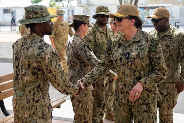 Chief of Navy Reserve Vice Adm. Nancy Lacore and Reserve Force Master Chief Tracy L. Hunt meet mobilized Sailors during a visit to Camp Lemonnier, Djibouti.