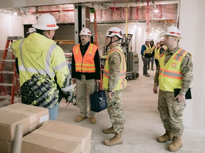 Capt. Matthew Purdy (right), who is currently serving as project engineer on the Canandaigua VA Medical Center project, participates in a site tour of the project.