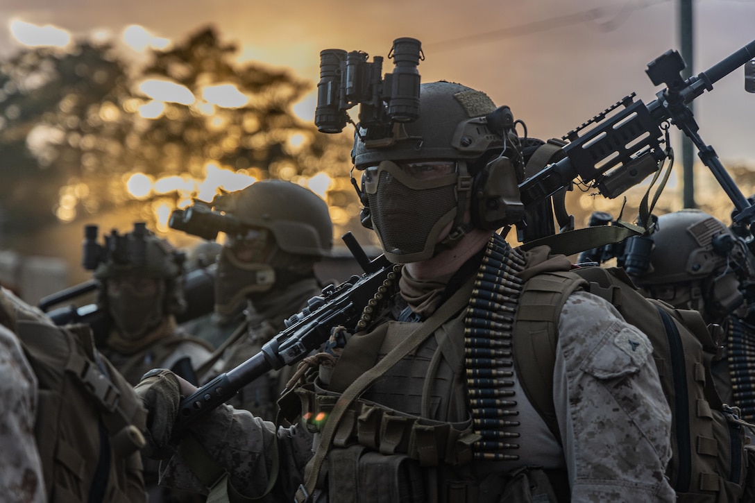 A U.S. Marine with Maritime Special Purpose Force, 22nd Marine Expeditionary Unit, prepares to conduct a night raid during Marine Air-Ground Task Force (MAGTF) Interoperability exercise at Stone Bay at Marine Corps Base Camp Lejeune, North Carolina on Jan. 30, 2025. The raid is one of several training events with MAGTF Interoperability, a course conducted by Expeditionary Operations Training Group (EOTG). This course is designed to train and evaluate integrated elements of the 22nd MEU across a variety of full mission profiles in a simulated peer threat environment. (U.S. Marine Corps photo by Cpl. Emily Hazelbaker)