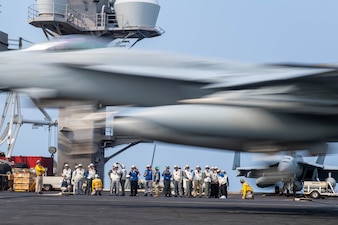 Government officials from Thailand and members of the Royal Thai Armed Forces observe flight operations aboard the Nimitz-class aircraft carrier USS Carl Vinson (CVN 70) while underway in the South China Sea.