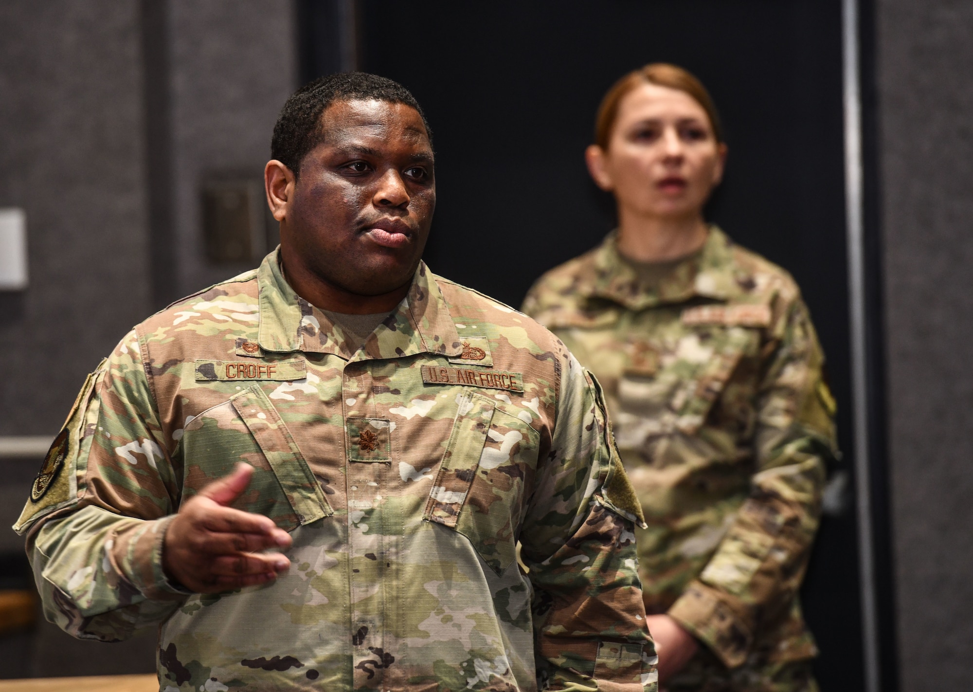 Maj. Quinton Croff, 55th Comptroller Squadron commander, addresses Airmen at the Urschler Theater on Offutt Air Force Base, Jan. 30, 2024. In a series of all calls, senior leaders met face-to-face with personnel to address key policy changes and provide an open forum for discussion. (U.S. Air Force photo by Chad Watkins)