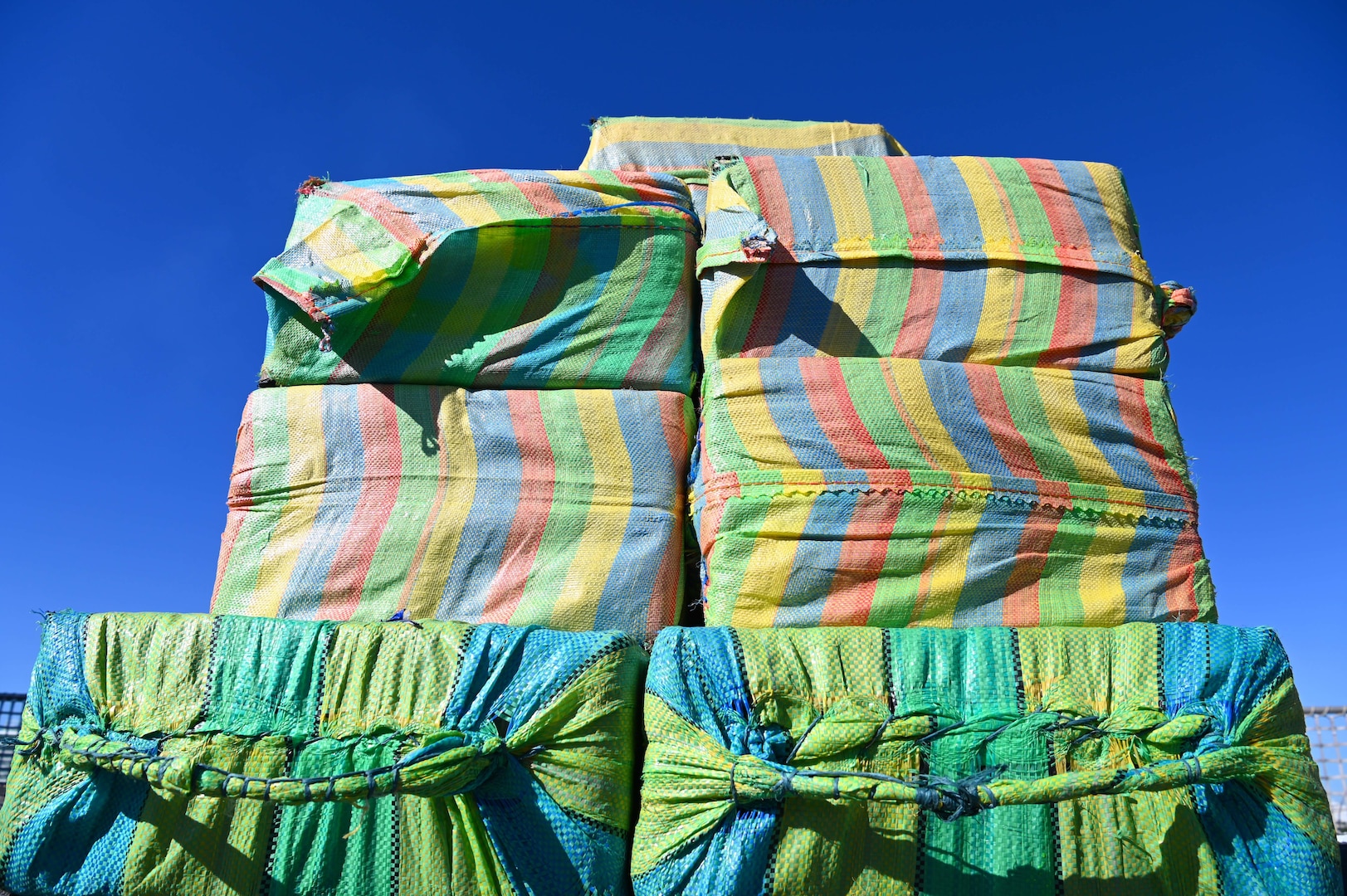 Crew members from USCGC Campbell (WMEC 909) offload more than 8,000 pounds of cocaine worth an assessed street value of approximately $91.3 million in Port Everglades, Florida, Jan. 27, 2025. The Campbell crew offloaded the illegal drugs from two interdictions in the international waters of the Eastern Pacific Ocean. (U.S. Coast Guard photo by Petty Officer 1st Class Diana Sherbs)