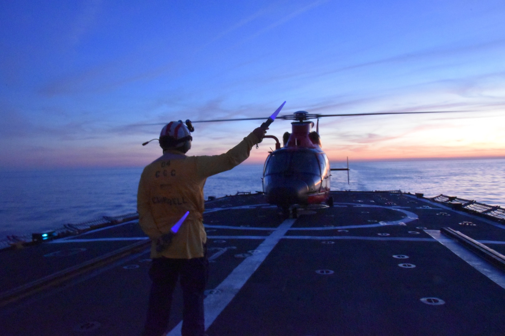 Coast Guard Cutter Campbell (WMEC 909) crewmembers conduct helicopter to deck landing qualifications at sea with aircrews from the Coast Guard Helicopter Interdiction Tactical Squadron, Jan. 30, 2025, off the coast of Florida. Campbell also embarked nearly sixty personnel from other Coast Guard cutter crews for hands-on shipboard-helicopter operations training. (U.S. Coast Guard photo by Petty Officer 3rd Class Chasey Oltman)