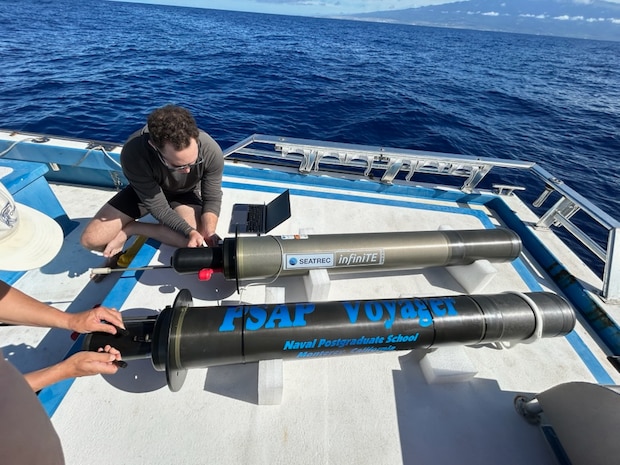 Researchers prepare the Persistent Smart Acoustic Profiler (PSAP) Voyager for initial testing in Monterey Bay.