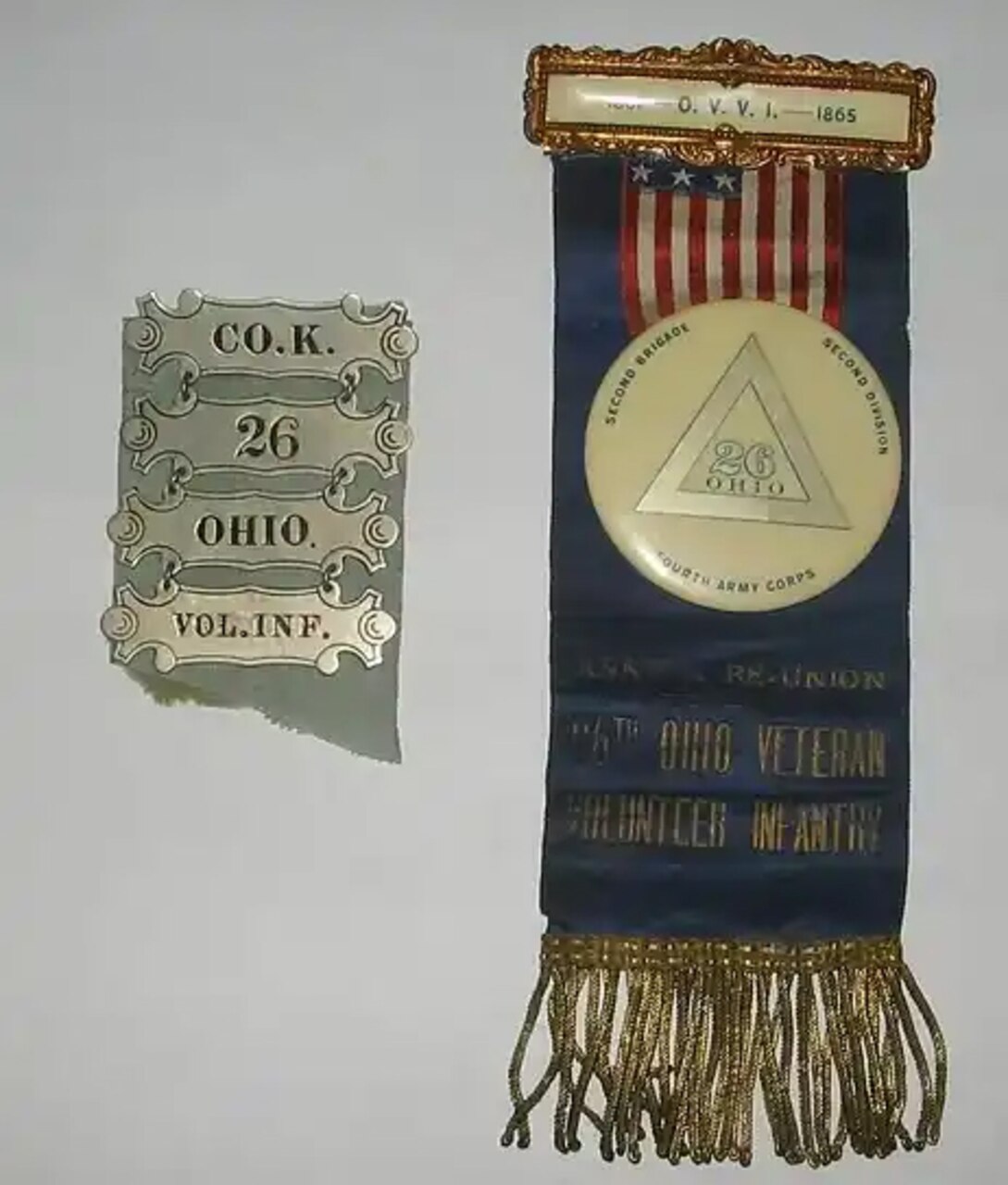 A badge and ribbon with gold fringe.