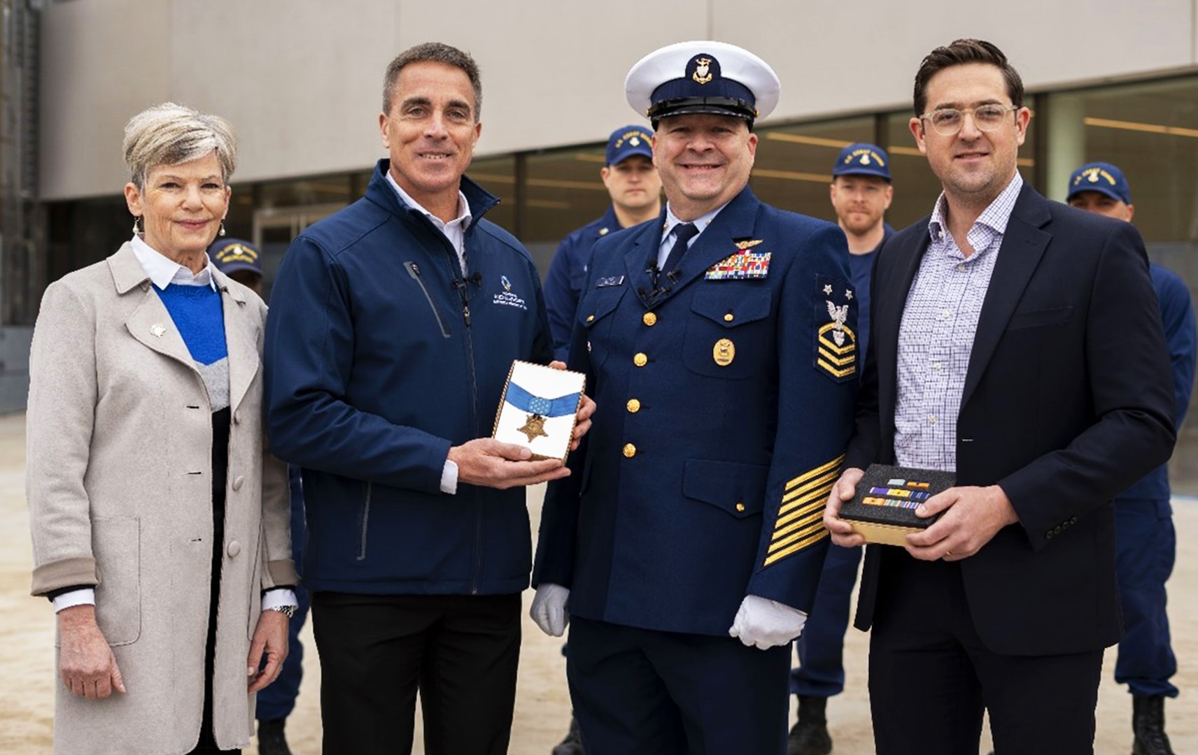 Ellyn Metcalf, Vice President of Education at National Medal of Honor Museum Foundation, Chris Cassidy, President and CEO of the Museum Foundation, accept Douglas Munro’s Medal of Honor from Master Chief Petty Officer Shawn Burns, Command Master Chief of the Eight Coast Guard District and James Brundage, Director of Programs and Exhibits for the National Coast Guard Museum, Jan. 28, 2025 (U.S. Coast Guard photo courtesy of Petty Officer 3rd Class Perry Shirzad)