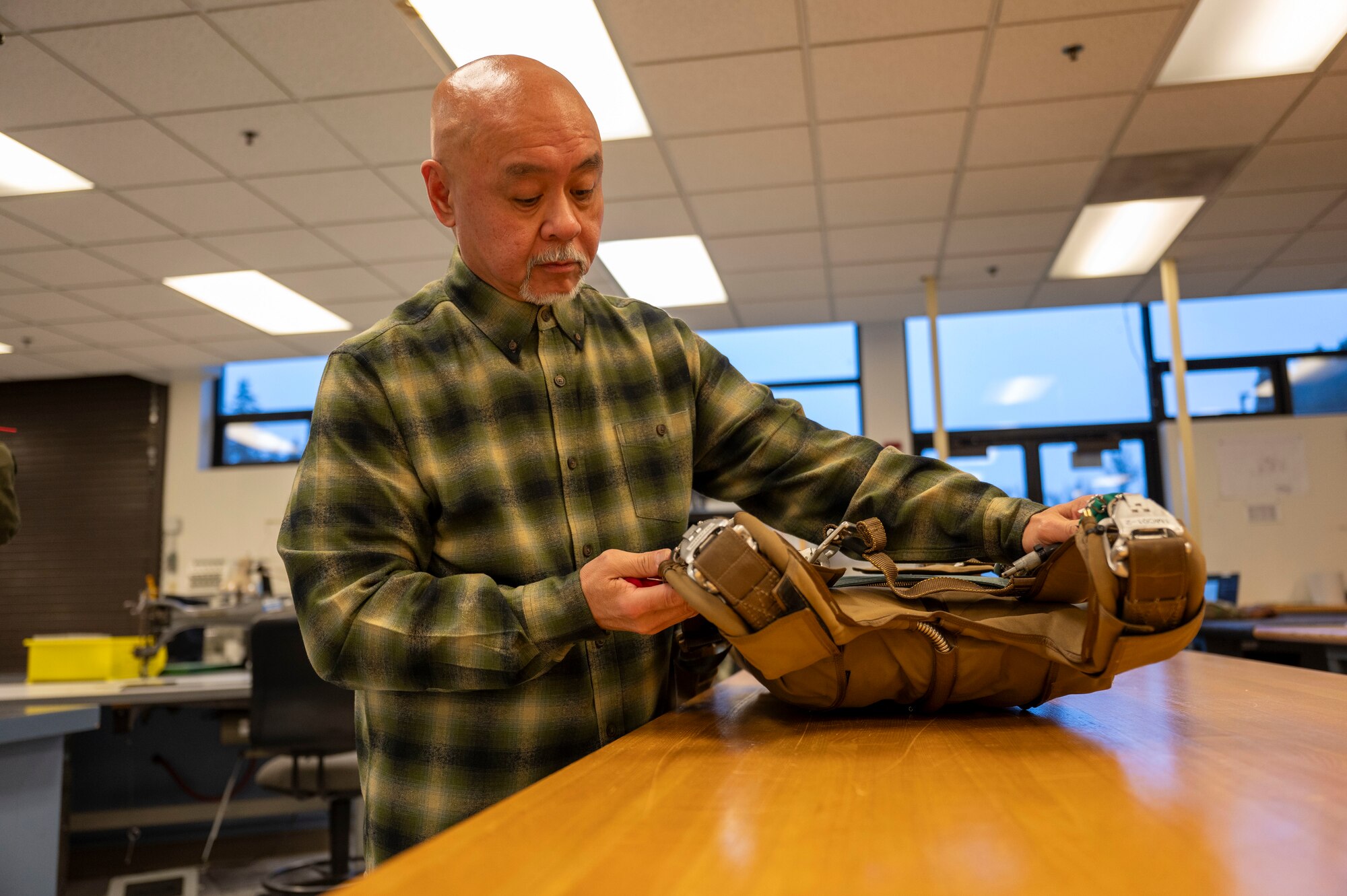 Cedrick Del Castillo, Aircrew Flight Equipment foreman with the 62d Operations Support Squadron, showcases his office at Joint Base Lewis-McChord, Washington, Jan. 13, 2025