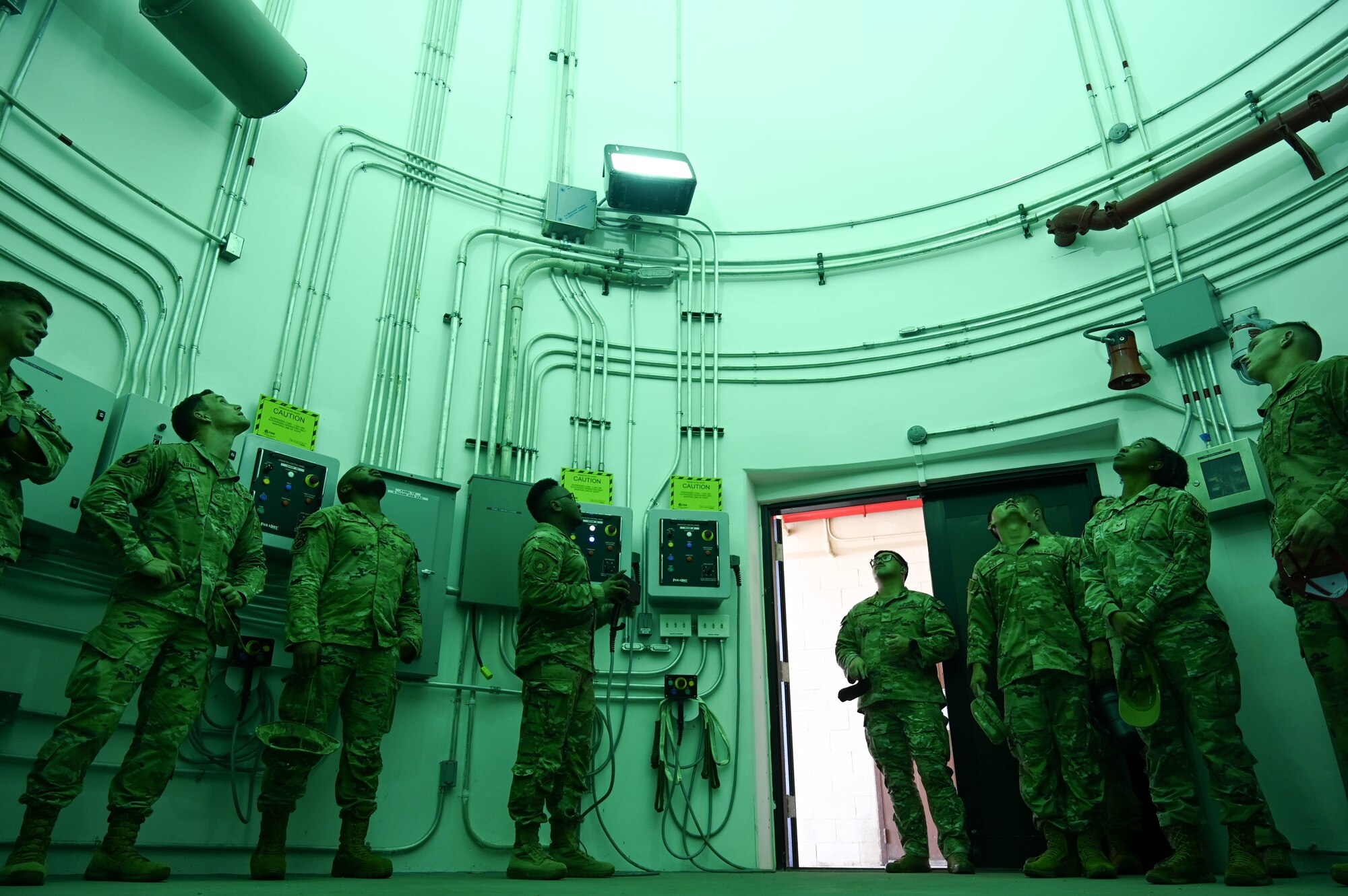 Airman Leadership School students observe the parachute drying facility on Andersen Air Force Base, Guam, Jan. 31, 2025. The Airmen toured the facility as part of a 36th Operations Group-led tour just two weeks before their expected graduation date. (U.S. Air Force photo by Airman 1st Class Natasha Ninete).