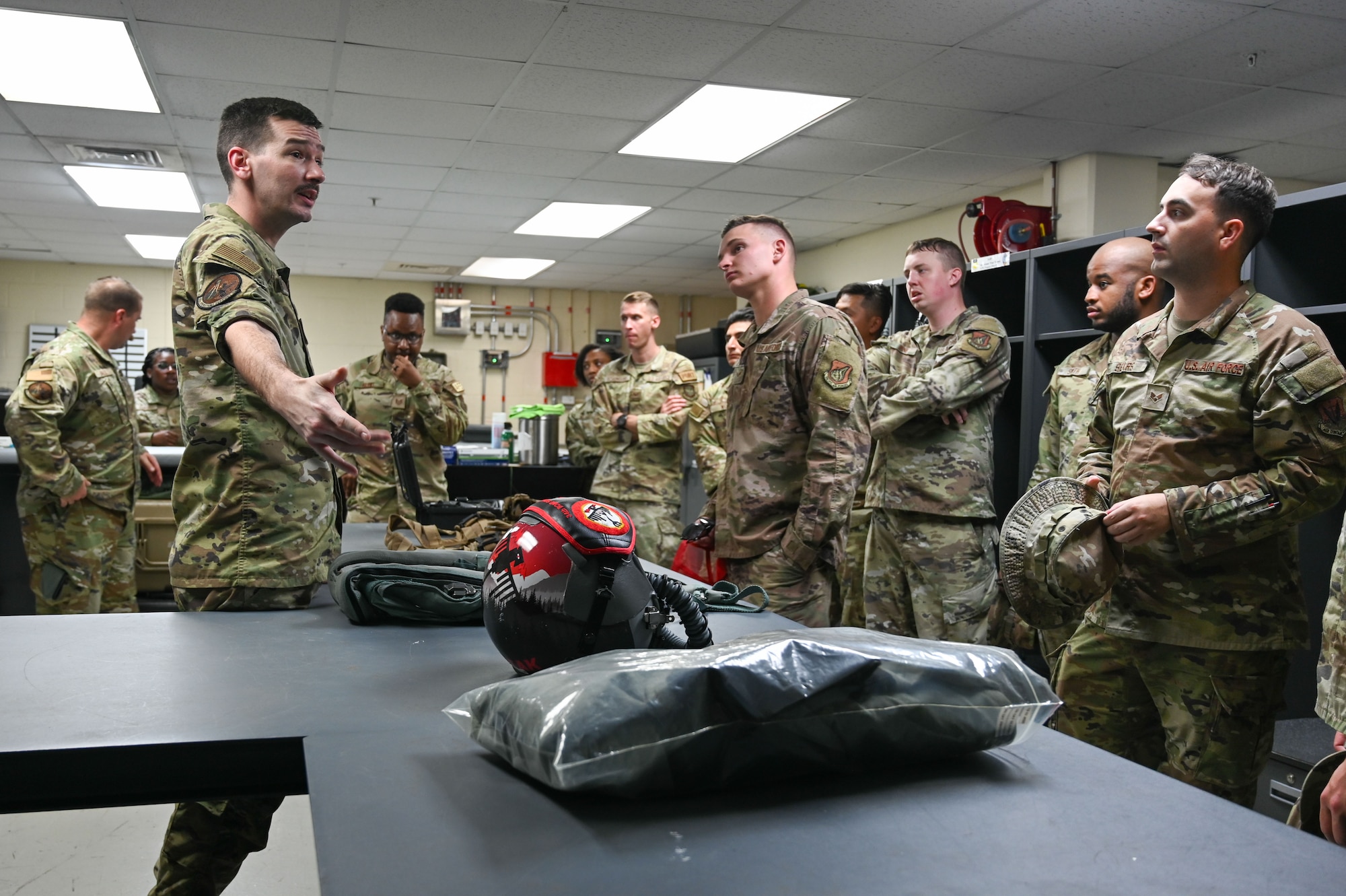 U.S. Air Force Technical Sgt Cody Whittenburg, 36th Operations Support Squadron, briefs Airman Leadership School (ALS) students on different flight equipment at Andersen Air Force Base, Guam, Jan. 31, 2025. The ALS students also received a comprehensive tour of the air traffic control tower and a B-1 Lancer. (U.S. Air Force photo by Airman 1st Class Natasha Ninete).