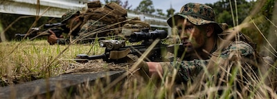 CAMP HANSEN, OKINAWA, Japan (Feb. 3, 2025) — U.S. Marine Corps Pfc. Javohn Thorne sets security during a patrol at Camp Hansen, Okinawa, Japan, Feb. 3, 2025. Marines with 12th Marine Littoral Regiment refine their patrolling skills through offensive and defensive exercises, as well as reconnaissance operations, to enhance operational proficiency. By rehearsing patrols, these Marines improve their ability to move swiftly and efficiently, minimizing the risk of detection while strengthening unit cohesion and teamwork. Thorne, a native of Washington, is a combat engineer with 12th MLR, 3d Marine Division. (U.S. Marine Corps photo by Lance Cpl. Rodney Frye)
