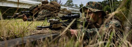 U.S. Marine Corps Pfc. Javohn Thorne sets security during a patrol at Camp Hansen, Okinawa, Japan, Feb. 3, 2025.