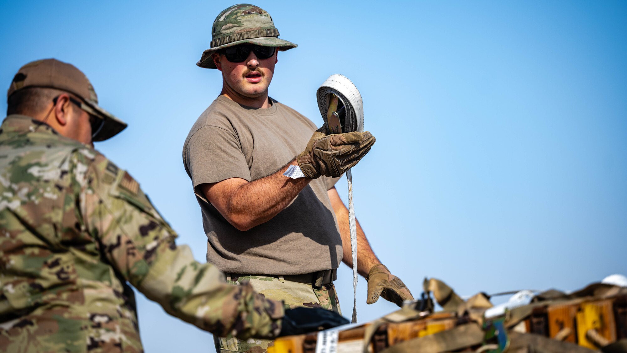 Airman secures a pallet.