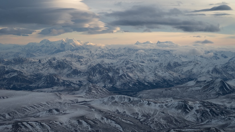 Mountains near Alaska Range, Alaska, Jan. 18, 2025. The 40th Airlift Squadron led a multi-element C-130J Super Hercules formation through Alaska Range at low-altitudes during the Joint Pacific Multinational Readiness Center 25-02 training exercise. JPMRC 25-02, conducted during Alaska’s coldest month, provided world-class training facilities and a harsh Arctic environment to build warriors capable of fighting anywhere in the world. (U.S. Air Force photo by Airman 1st Class Jade M. Caldwell)