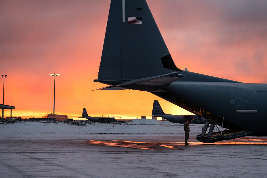 U.S. Air Force Airman 1st Class Gabriel Peifer, 40th Airlift Squadron loadmaster, guides a C-130J Super Hercules ramp during the Joint Pacific Multinational Readiness Center 25-02 training exercise at Joint Base Elmendorf-Richardson, Alaska, Jan. 22, 2025.Exercises like JPMRC sharpen Mobility Airmen’s readiness to distribute the Joint Force and ensure strategic deterrence in any environment across the entire competition continuum. (U.S. Air Force photo by Airman 1st Class Jade M. Caldwell)