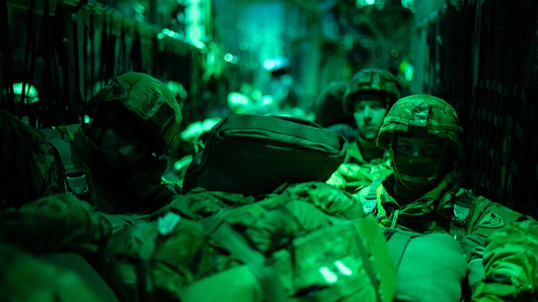 U.S. Army paratroopers from the 11th Airborne Division await airdrop in a C-130J Super Hercules during the Joint Pacific Multinational Readiness Center 25-02 training exercise near Joint Base Elmendorf-Richardson, Alaska, Jan. 22, 2025. Exercises like JPMRC sharpen Mobility Airmen’s readiness to distribute the Joint Force and ensure strategic deterrence in any environment across the entire competition continuum. (U.S. Air Force photo by Airman 1st Class Jade M. Caldwell)