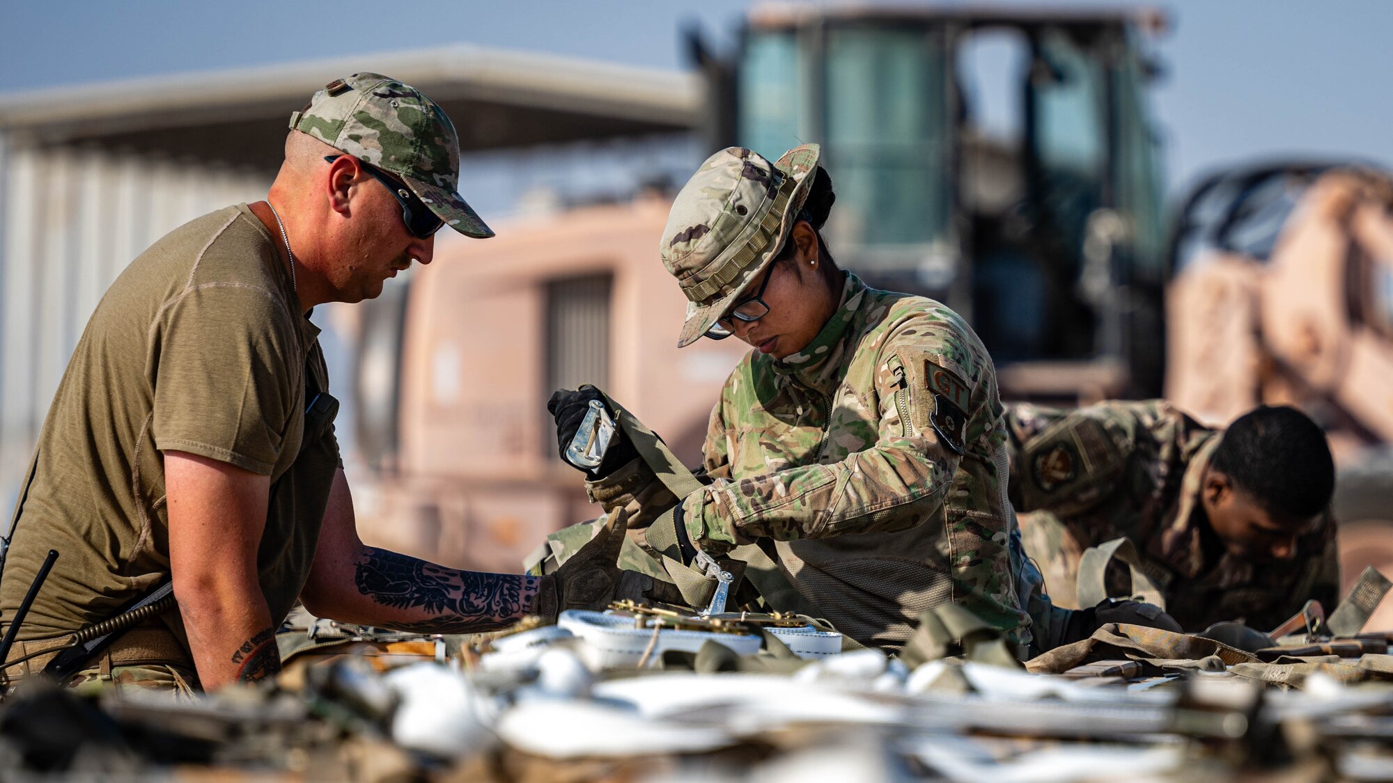 Airmen build pallets.