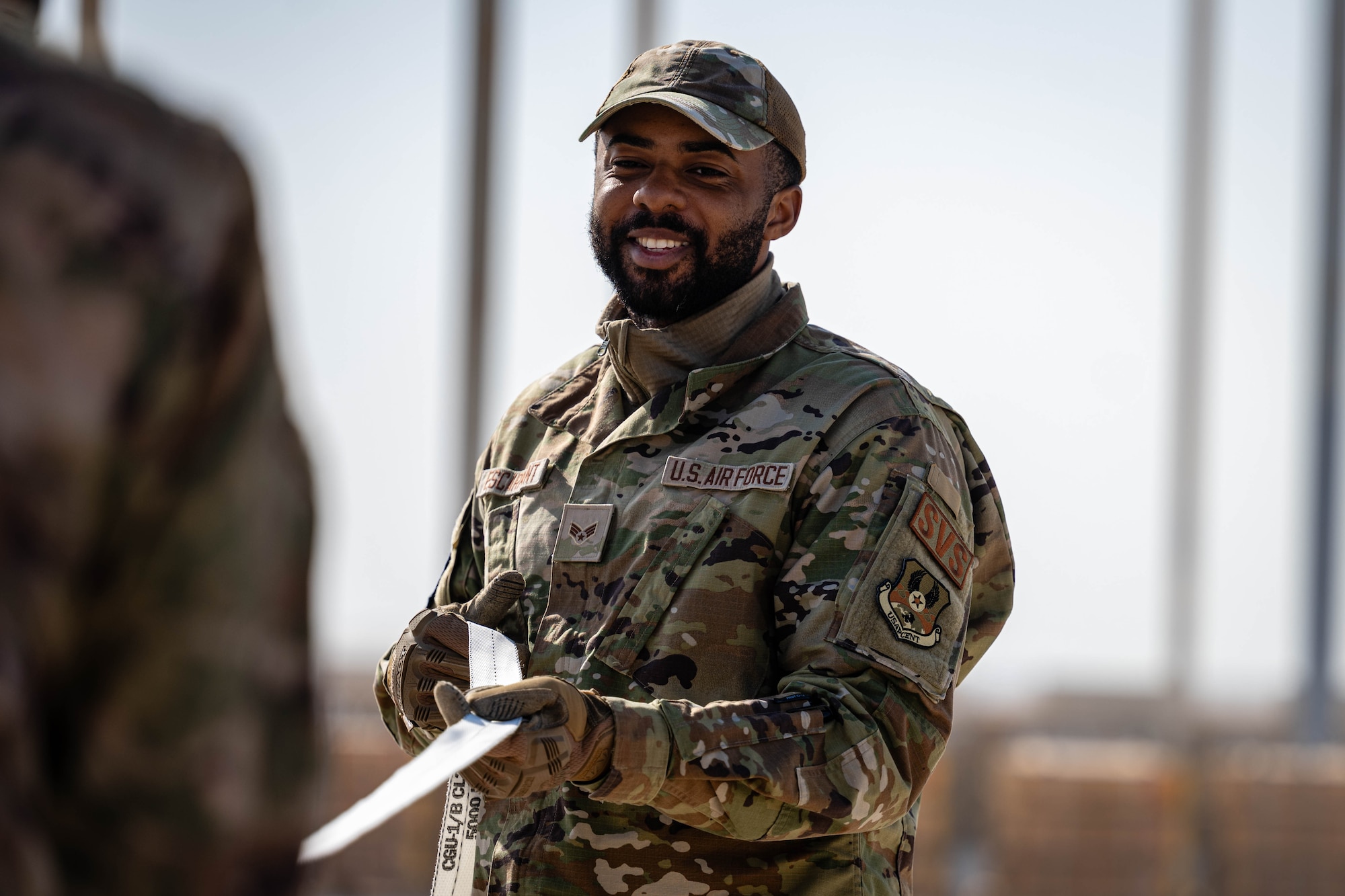 Airman secures pallet.