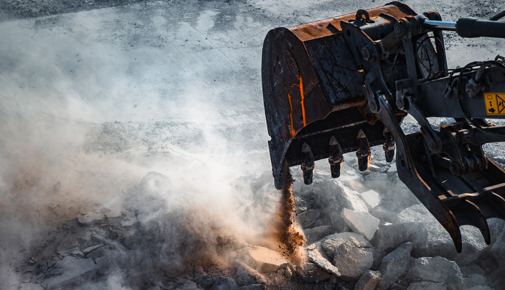 Excavator moves debris