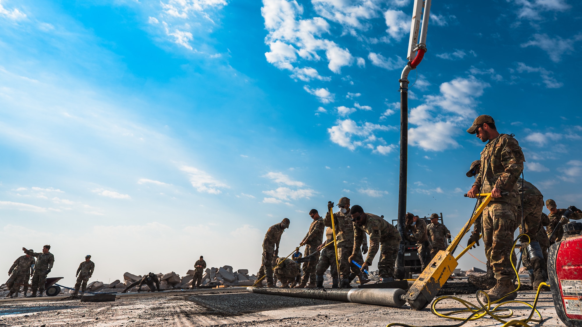 Airmen reconstruct training pad