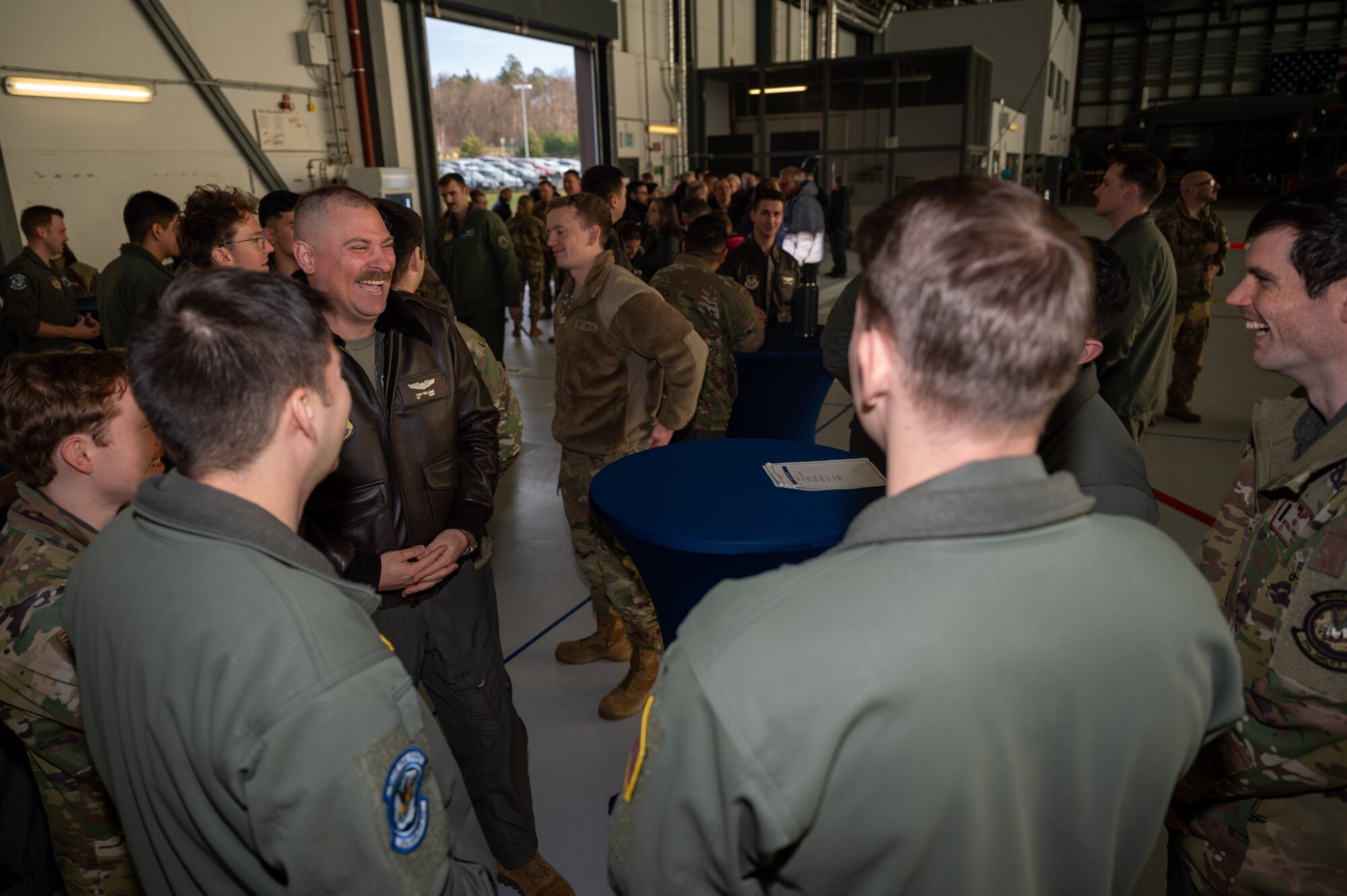 Airmen assigned to the 37th Airlift Squadron celebrate the groundbreaking ceremony of the installation of a new operations center at Ramstein Air Base